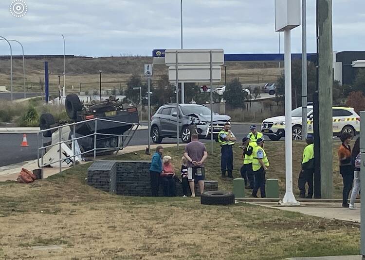 CRASH SCENE: Police and other emergency services at the scene of Sunday's rollover in Kelso. Photo courtesy of Top Notch Video.