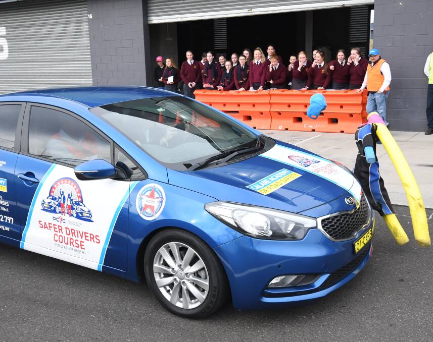 RYDA: Demonstration of braking at speeds from 40, 50, 60 and  80 KPH to Year 11 students from MacKillop College attending the RYDA course held at Mount Panorama Pit Complex,Tuesday. Photo:CHRIS SEABROOK 050818cryda1