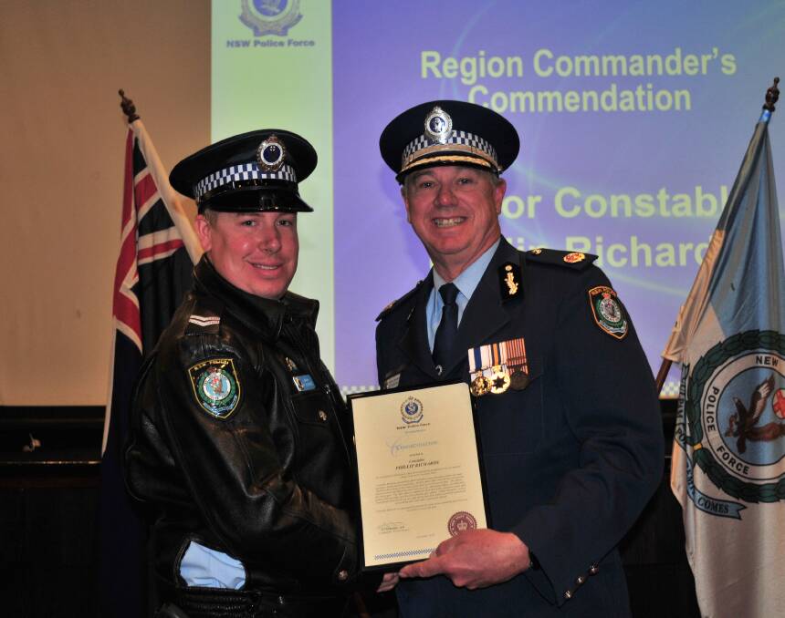 WESTERN REGION COMMENDATION: Constable Phillip Richards receives a Western Region Commendation from Assistant Commissioner Geoff McKechnie. 