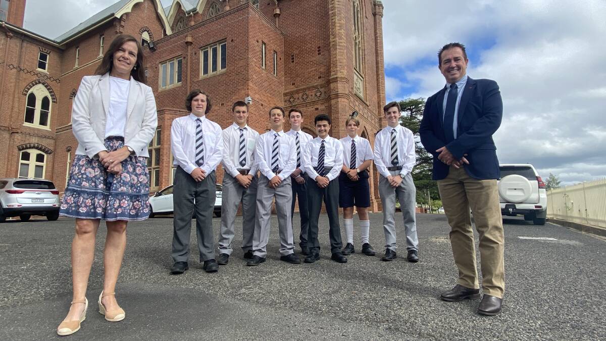 HISTORY: Paul Toole, right, with St Stanislaus College Dean of Learning Improvement and Innovation Melissa Lang and students.