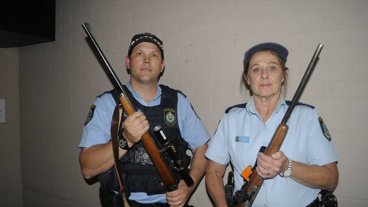 NEW LAWS: Chifley Area Command officers, Senior Constable Matt Holden and Senior Constable Sue Rose, discussing firearm security at home. Photo:CHRIS SEABROOK 101717csecure1a