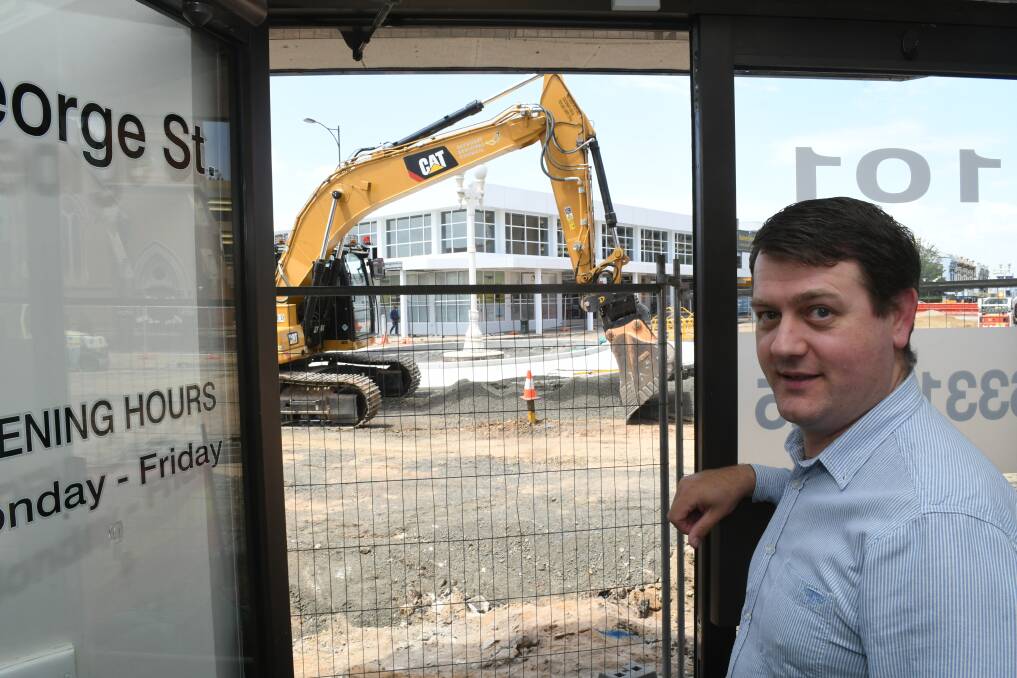 NEARLY TO THE DOOR: Advanced Hearing Solutions director Matthew O'Neill with the George and Howick street upgrade outside his premises. Photo: CHRIS SEABROOK
