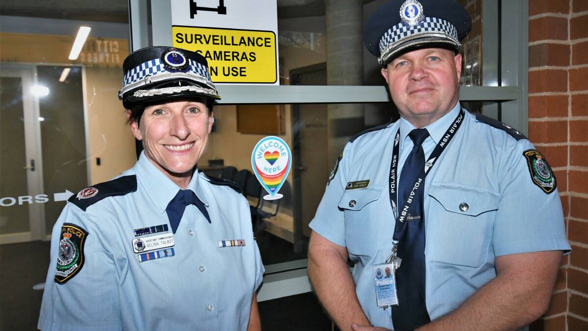 WELCOME HERE: Assistant Commissioner Gelina Talbot with Supt. Bob Noble, with the Welcome Here signage, at Bathurst Police Station.