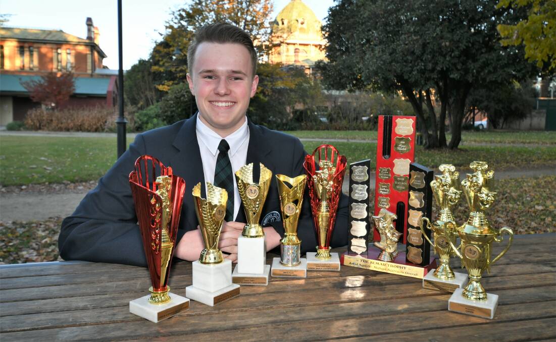 A STAR ON STAGE: Performing arts student Toby Gough with some of his trophies from Cowra. Photo: CHRIS SEABROOK.