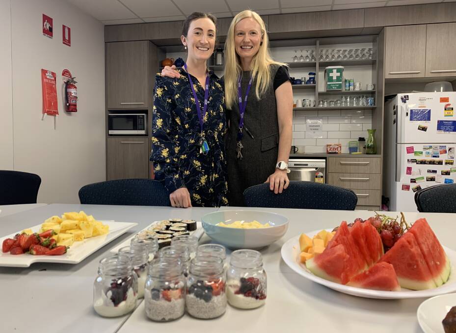 HEALTHY EATING AND MENTAL HEALTH: Anna Winter (dietitian) and Anna Blackie, from Marathon Health, with examples of healthy foods.