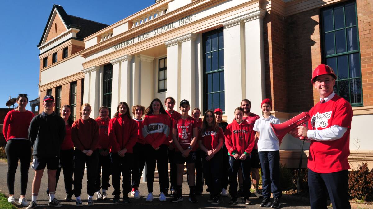 SHOUT OUT TO WEAR IT RED: Bathurst High principal Ken Barwick with students from the school, ready to "Wear it Red."