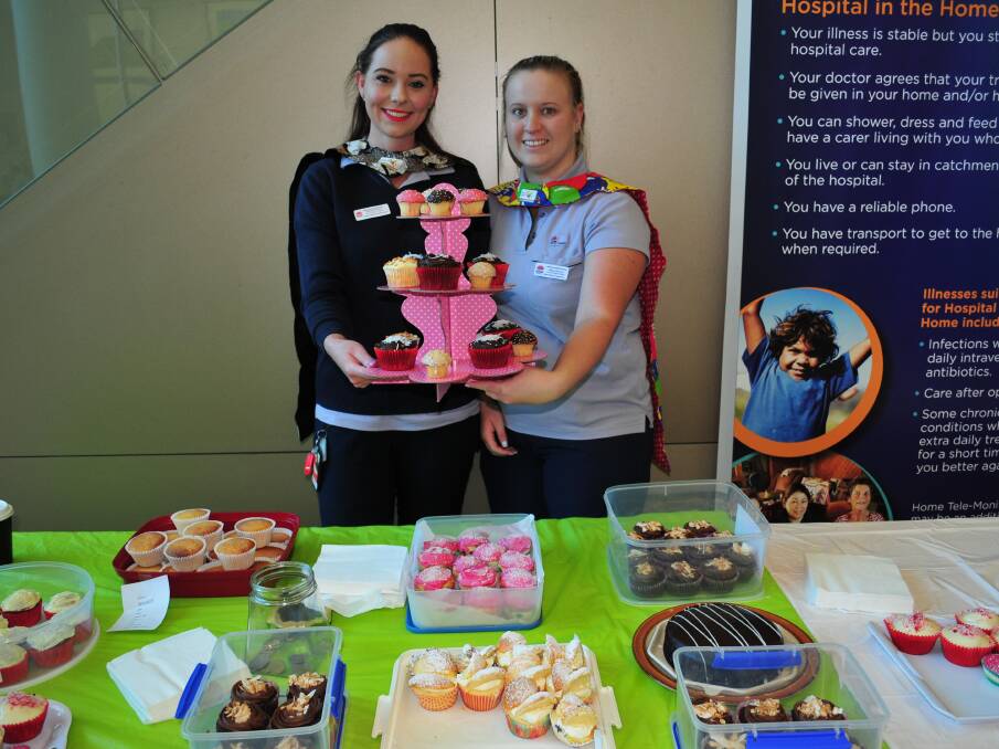 CAKES FOR CAPES: Clinical Support Officers, Melinda Nockles and Megan McKelvie, selling cakes at the Cakes for Capes day.