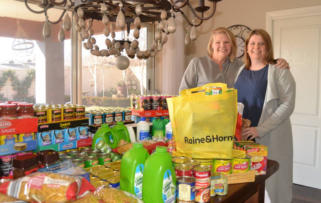 HELPING HAND: Megan Fawkner, and Alice Winwood-Smith, from DeJorja, with some of the products donated to help local farming families. 