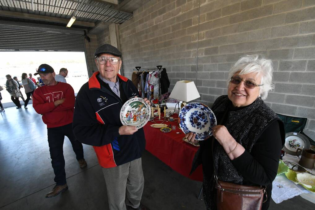 GREAT DAY: Peter Hein and Renee Boudet with their items for sale at the Bathurst Community Garage Sale, held in Pit Lane, Mount Panorama.