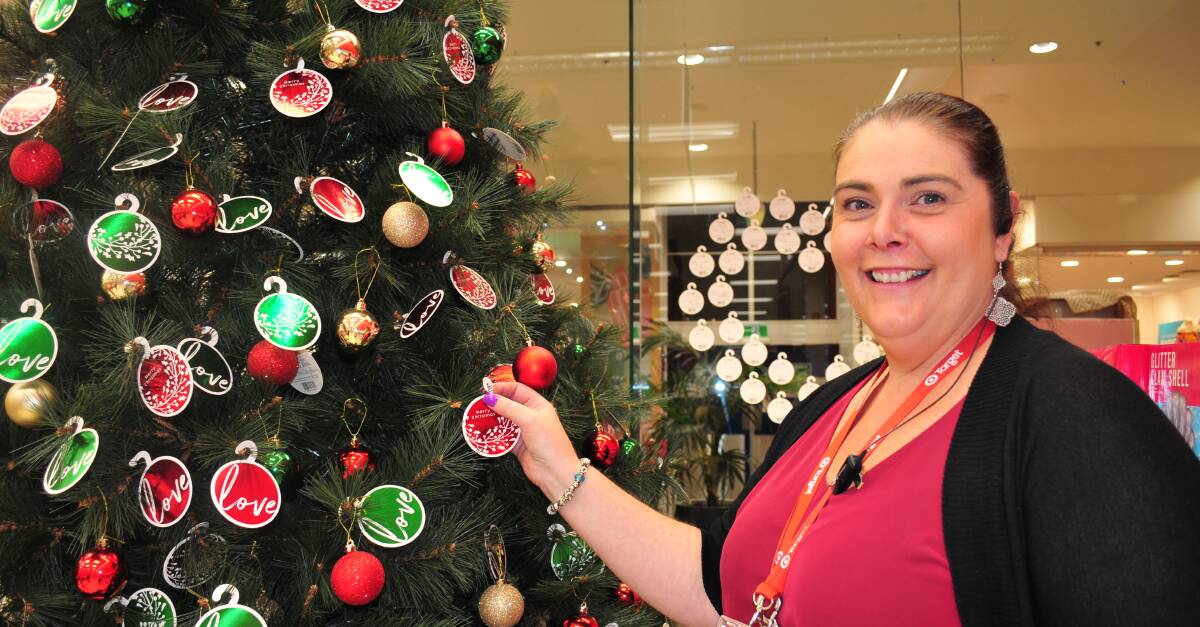 CAN YOU HELP: Lisa Morrison, manager of Target, with some of the $2 baubles already donated.