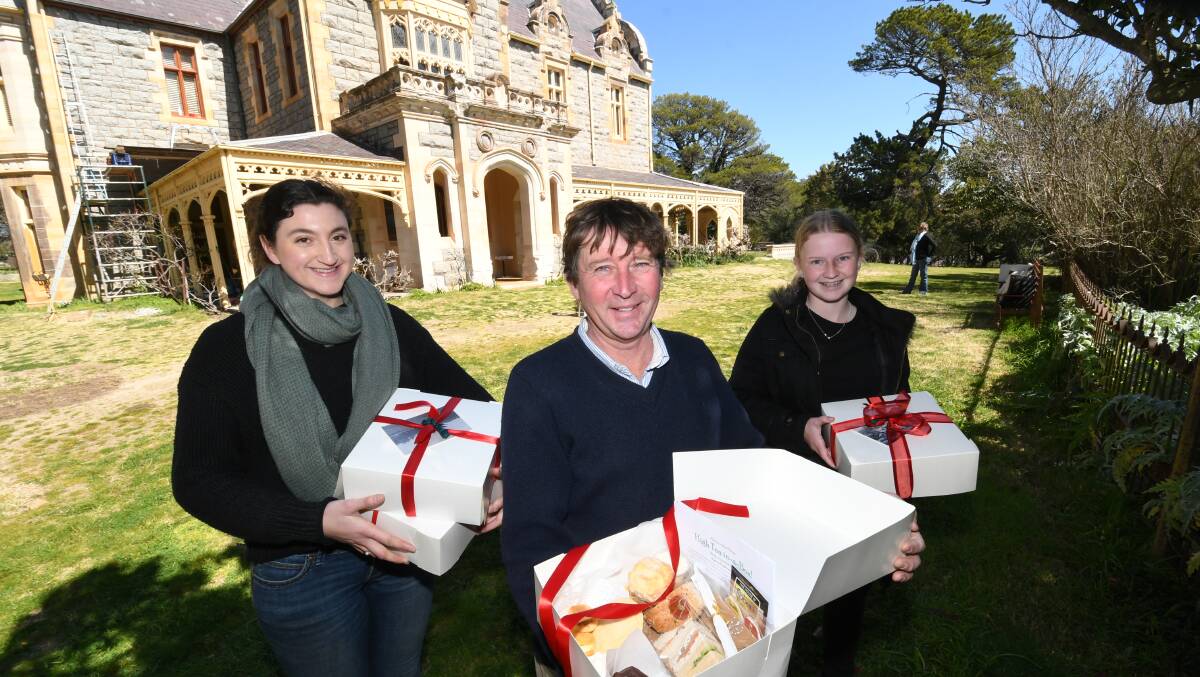 HIGH-TEA-IN-A-BOX: Christopher Morgan (centre) with staff Priscilla Evans-Gittany and Sarah Knox in the grounds of Abercrombie House