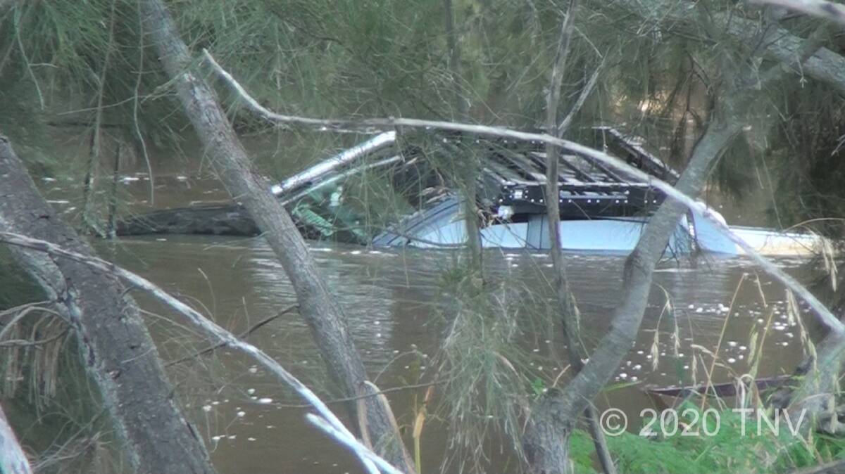 Three rescued from roof of submerged vehicle. Photos: TOP NOTCH VIDEO