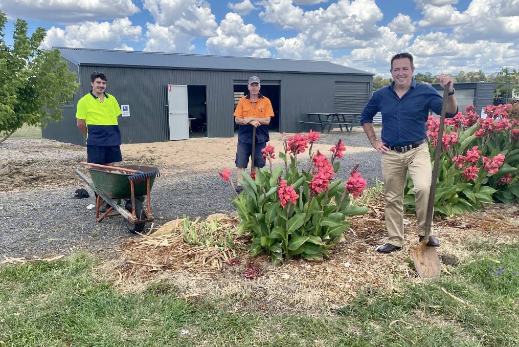 DIG IN: Rob Jamieson, Anthony Coan and Bathurst MP Paul Toole outside the new shed at the community garden being developed by Hope Church.