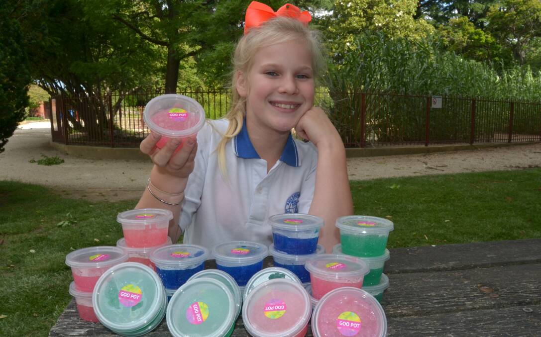 WATCH OUT BUSINESS WORLD: Ten-year-old Amity Covington with her Goo, which she makes at home and sells at fetes around the city.