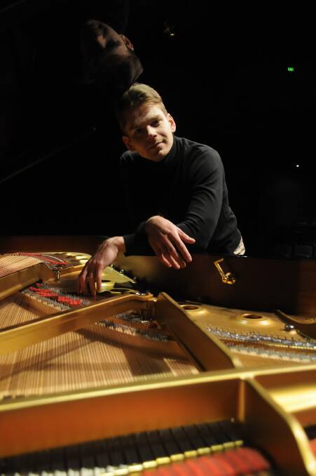 FROM RUSSIA TO BATHURST: Andrey Gugnin, at Bathurst Memorial and Entertainment Centre. Andrey performed at BMEC on Tuesday night, and held master classes during the day. Photo: CHRIS SEABROOK 080817candrey3a
