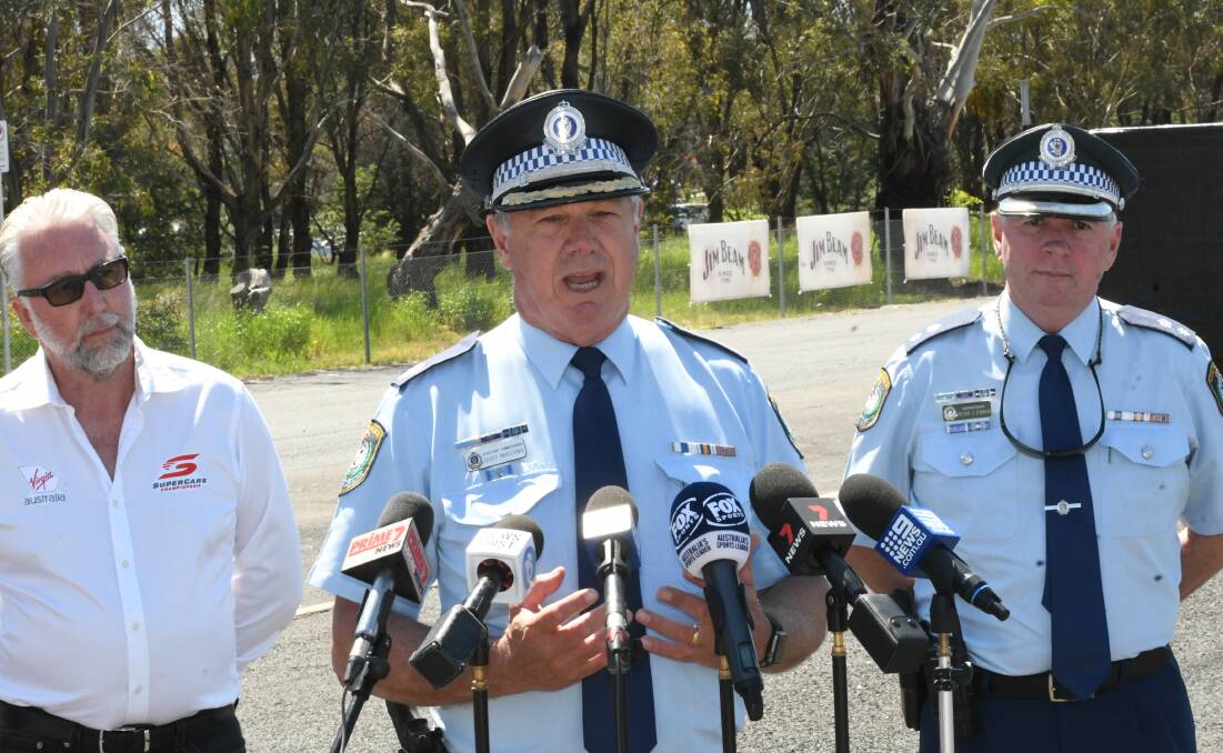 HIGH VISIBILITY OPERATION: Assistant Commissioner Geoff McKechnie, with Shane Howard (left, Supercars) and Supt Peter O'Brien.
