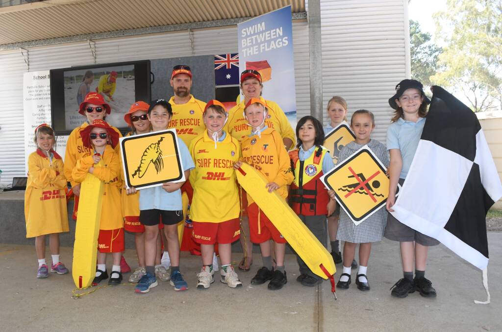 SWIM BETWEEN THE FLAGS: Students from Perthville Public School with James Worrall and Kim Rayner, who are part of the Beach to Bush program.