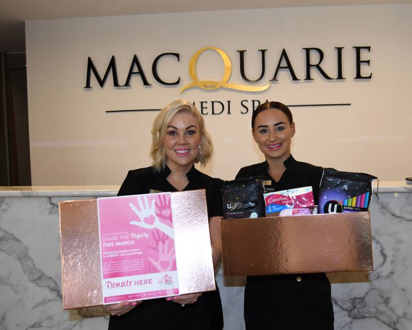 SHARING THE DIGNITY: Director, Macquarie Medi Spa, Karla McDiarmid, with beauty therapist Taylor Fenton.