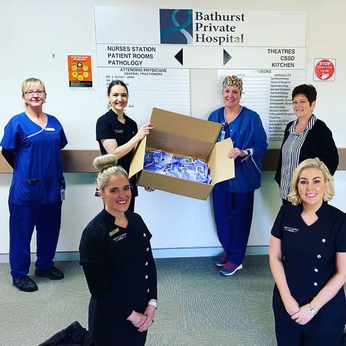 THANK-YOU: Karla McDiarmid, director of Macquarie Medi Spa, front right, with staff from Bathurst Private Hospital.
