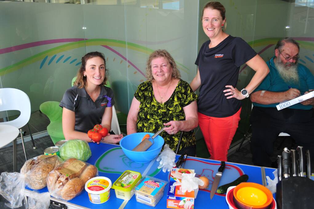 HEALTHY OPTIONS: Anna Winter (dietitian) Michelle Duff and Shellie Burgess, portfolio manager, at the healthy cooking course. 