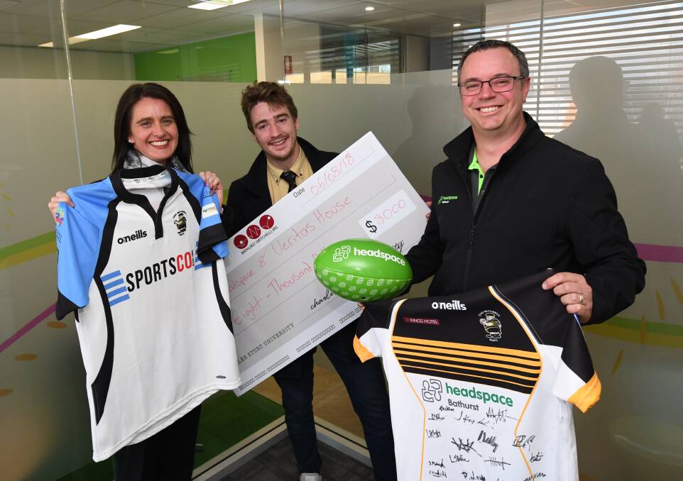DONATION: Narelle Stocks, Angus Kennelly from Mitchell Rugby and Peter Rohr (from headspace) Photo:CHRIS SEABROOK 080618cheq1