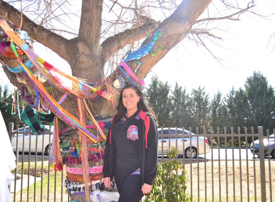 VISION: Director of Towri MACS, Courtney Glazebrook, pictured in the grounds of Towri Macs, near a tree decorated by some of the children who attend the centre.