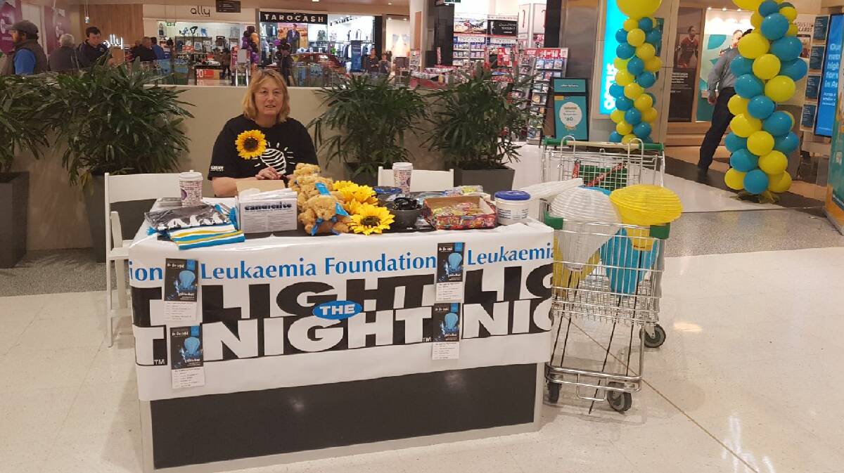 LIGHT THE NIGHT: Light the Night committee member Fiona Mundey at the stall which was set up at Bathurst City Centre late last month.