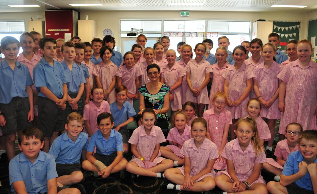 GREAT CAREER: Cathy Matthews surrounded by her adoring students at Assumption School.