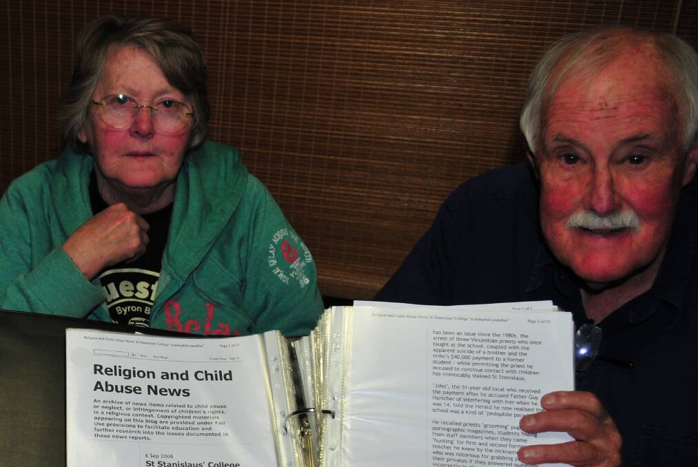 FACING THE PAST: Carole Clarke with retired journalist Terry Jones and his files detailing court cases covering historical child sexual abuse at Stannies.