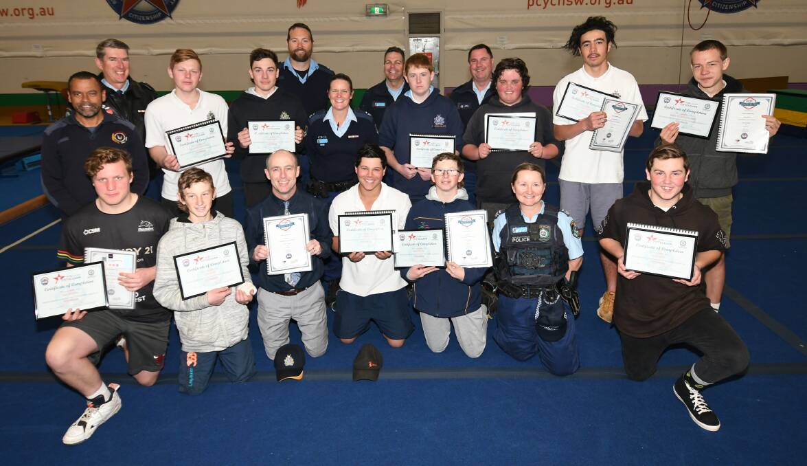 GRADUATES: Bathurst High students who graduated from the PCYC program, pictured with their certificates and mentors. Photo: CHRIS SEABROOK 091719criseup2