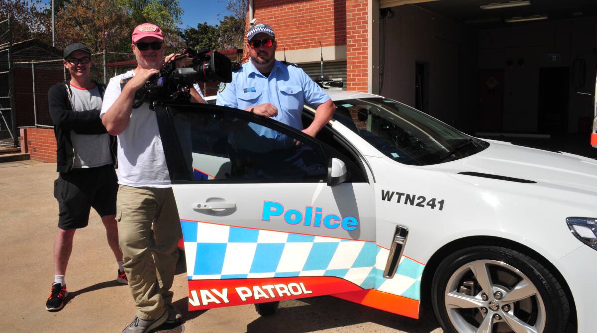 SERIOUS MESSAGE: Sen Const Aaron Unicomb, from Chifley Highway Patrol, cameraman Sean Mulcahy and producer Craig Gaudion.