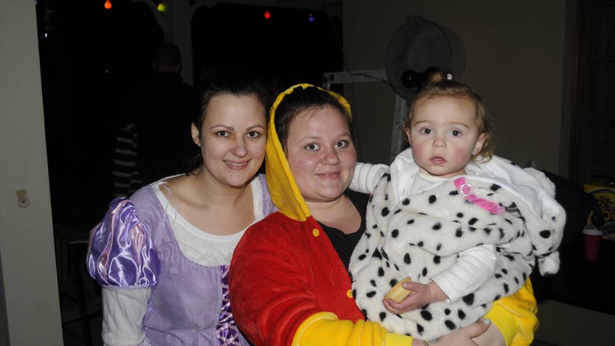 DRESSED TO THEME: Sam and Chloe Schofield with Ally Cheesman (2) at the party. 072917c18th5