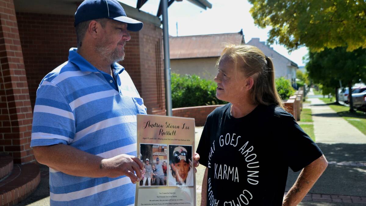 NEVER GIVE UP: Bruce Herbert and Sue Wallace, outside Bathurst Police Station, holding a picture of Andrew Russell, last seen in June 2009, following last year's announcement of a $750,000 reward for Andrew. PHOTO: Rachel Chamberlain