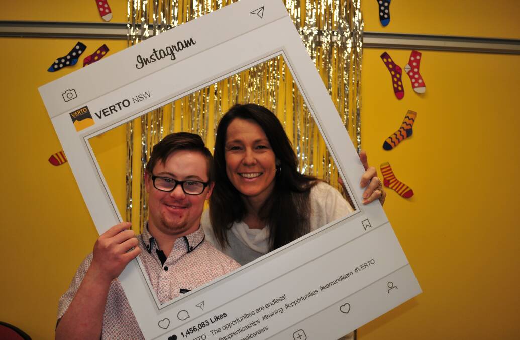 WORLD DOWN SYNDROME DAY: Mitch Smith, 20 with his mum Carol Smith, celebrating World Down Syndrome Day, at Verto, on Thursday.