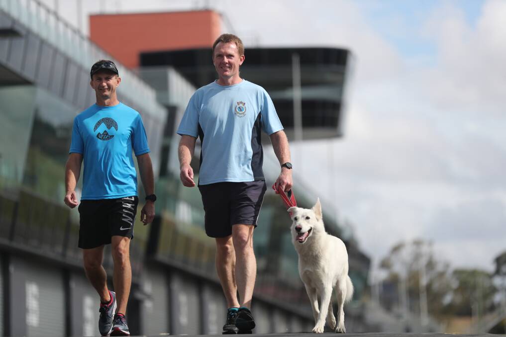 RAISING AWARENESS: Phil Mounce-Stephens with friend Todd McMahon and Phil's dog Molly training at the Mount. Photo: PHIL BLATCH