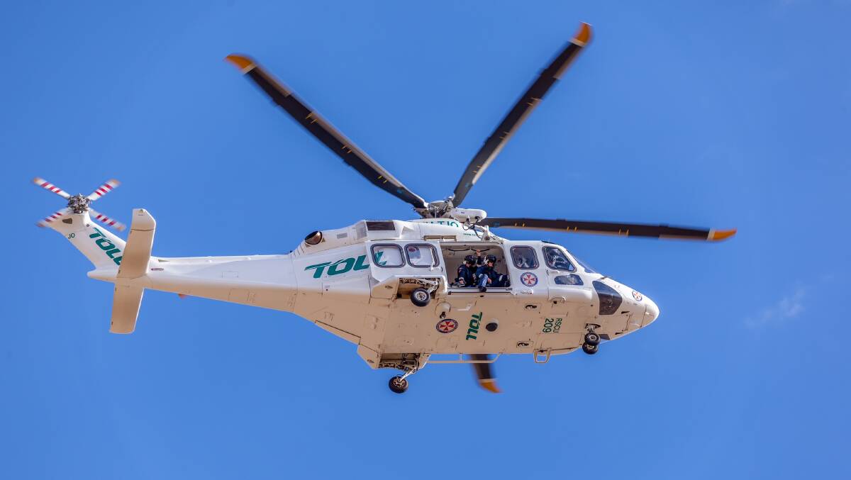 EMERGENCY CHOPPER:  A Toll helicopter's downdraft knocked an elderly woman over at Bathurst Base Hospital last Friday. PHOTO: Troy Pearson TOP NOTCH VIDEO