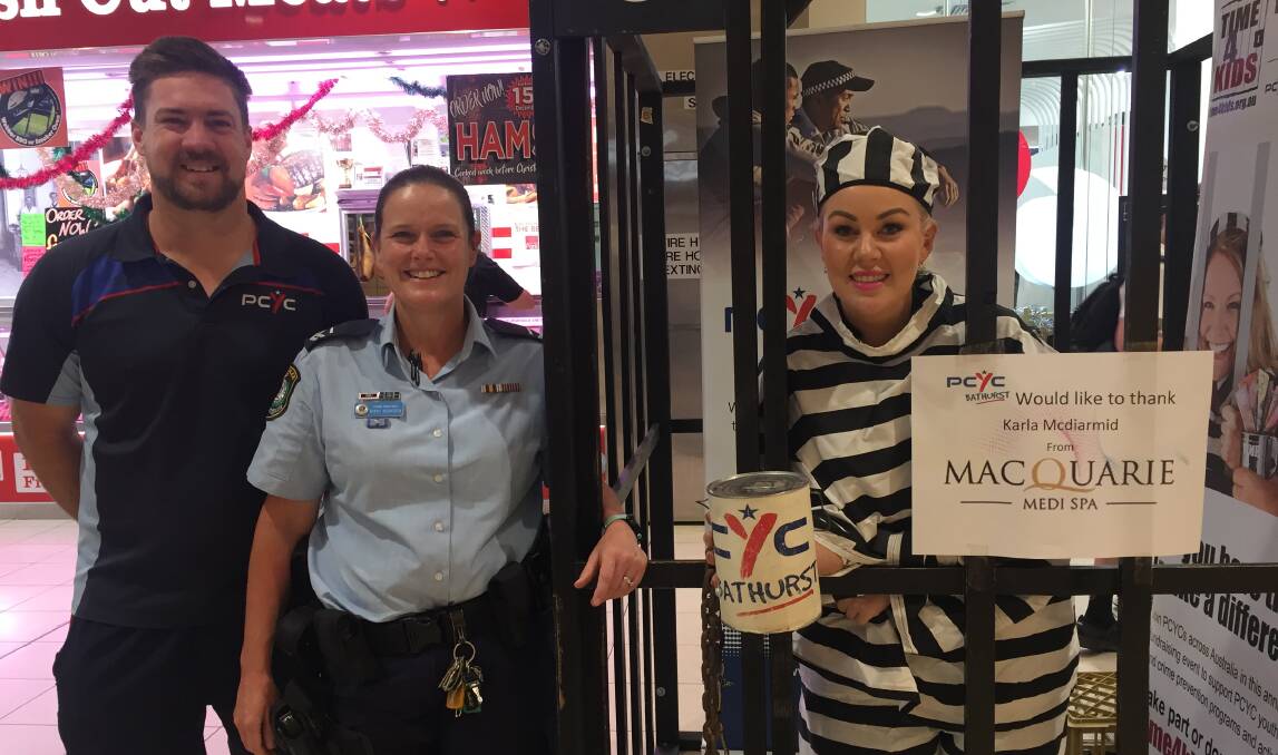"DOING TIME FOR KIDS": Dave Hitchick, Bathurst PCYC with Sen Const Rikki Bowden and Karla McDiarmid, Macquarie Medi Spa..