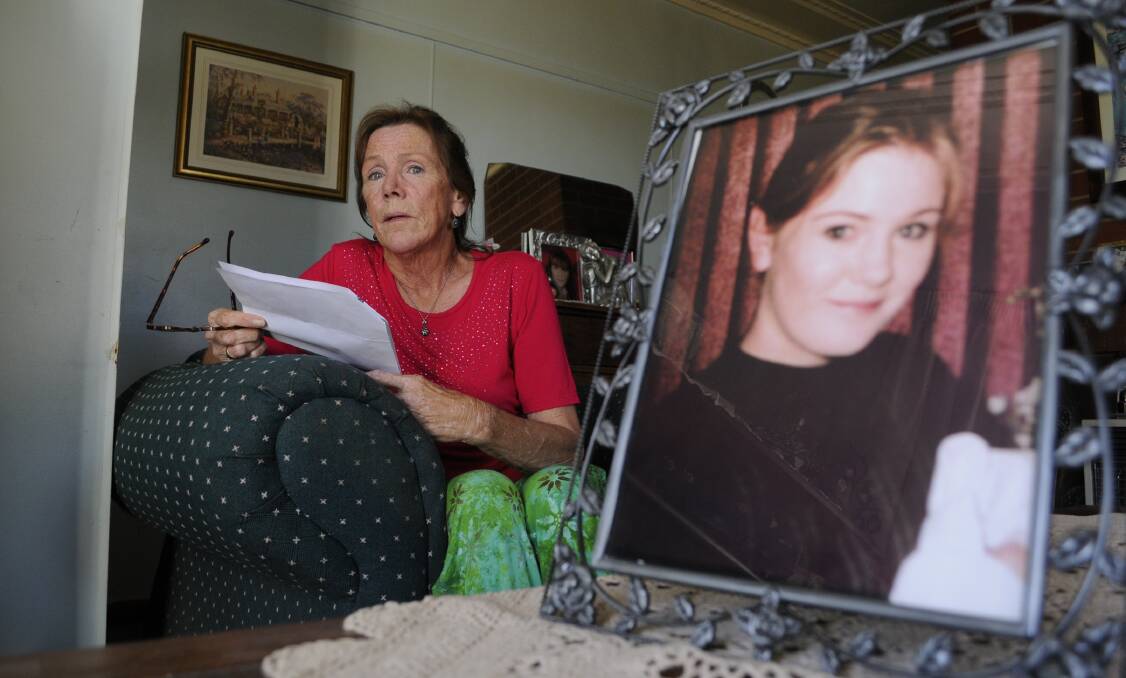 STILL HOPING: Ricki Small, with a picture of her daughter Jessica, abducted from Bathurst in October 1997. Photo: CHRIS SEABROOK