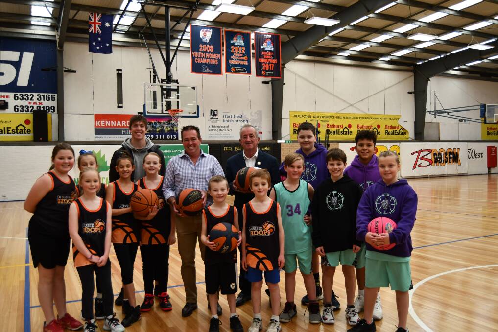 FUNDING BUT NO ROOF REPAIR: Andrew James, Cr Bobby Bourke and Member for Bathurst Paul Toole, with young players.