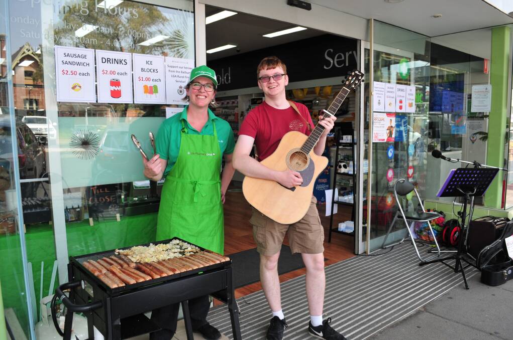 FUNDRAISING FOR OUR FIRIES: Alex Wood, business manager with Moodie's Pharmacy, and musician Cameron Russell at the fundraiser.