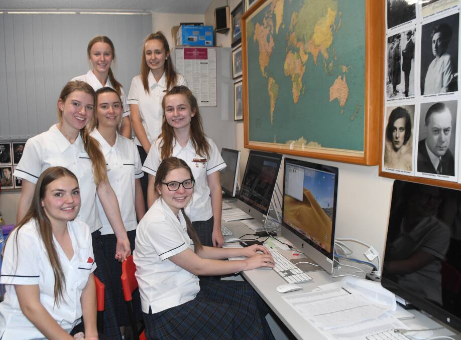 AT WORK: Year 11 students working on the MacKillop Video Vault, during their lunch time, at front Hollie Watters and Meg Wilson, Jayah Cowgill, Adrienne Slattery, Marnie Watson, Hannah Short and Katie Cuzner.