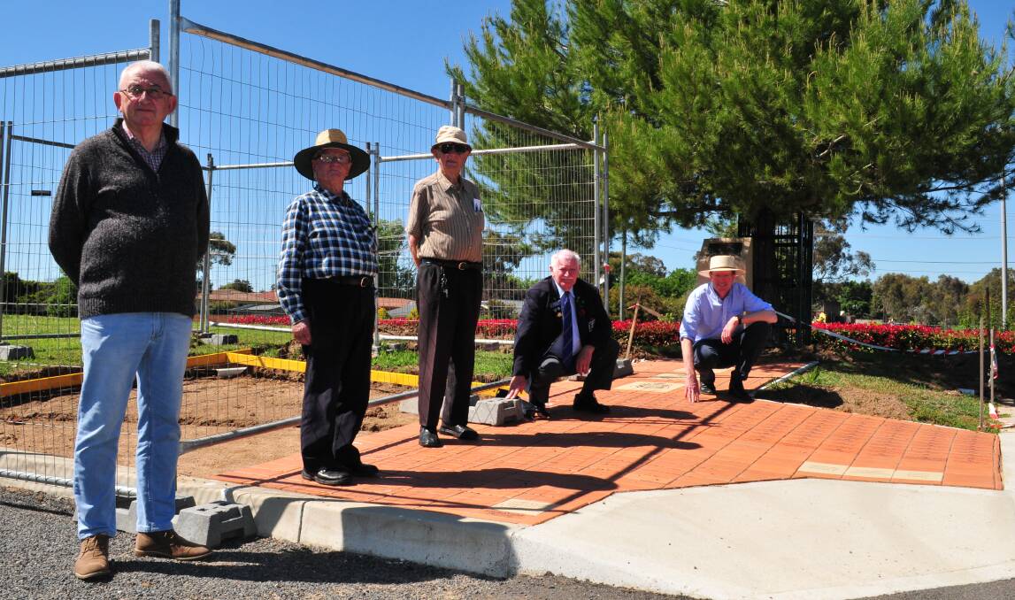 FUNDING GRANT: Jim Nash, Fred Collett, the Rev Howard Knowles, James Dietrich with Andrew Gee, pictured where the pavers will be laid.