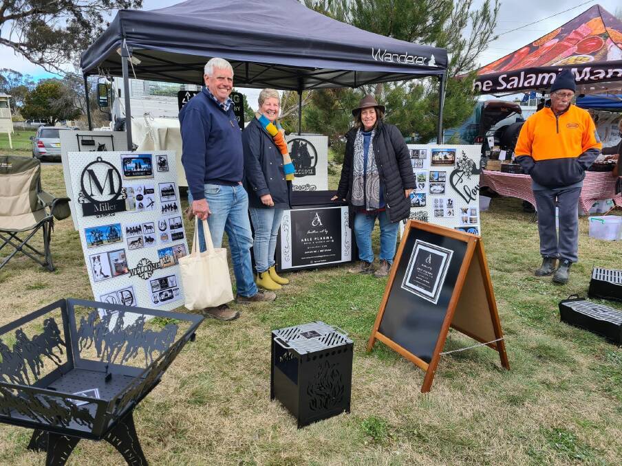 Linda Turcsanyi with customers -at her stall Able Plasma Metal and Garden Art Bathurst, which is a regular stallholder at the Tarana Markets.