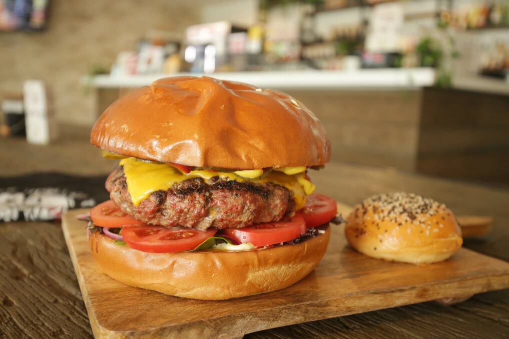 The two kilogram giant dwarfs an ordinary burger bun. Picture: Chris Lane