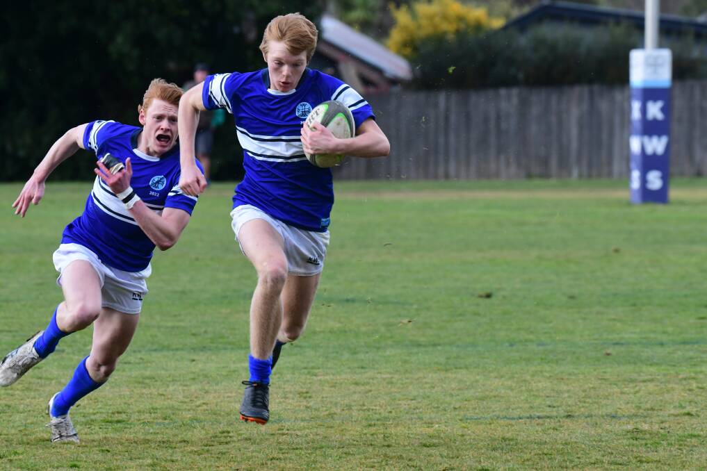 HARD FOUGHT: Jamie Anderson and Carter Kirby in action for Kinross in their First XV match against St Stanislaus' College. Photo: JUDE KEOGH.