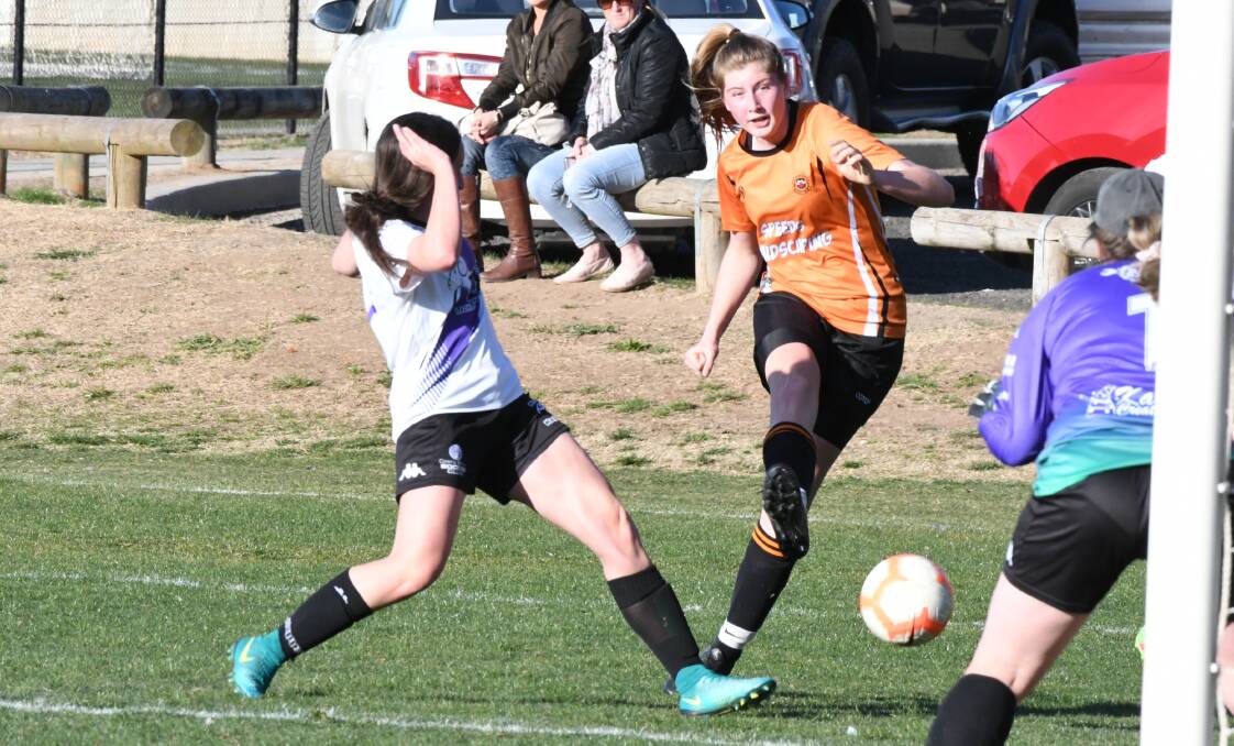 STRIKE: Macquarie United's Amy Parker fires off a shot against Cowra last season. Photo: CHRIS SEABROOK