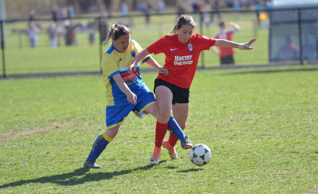 TACKLE: Tara Booth (left) in action for Eglinton FC last year. The club will field three women's teams across the top three grades in 2020. Photo: ANYA WHITELAW