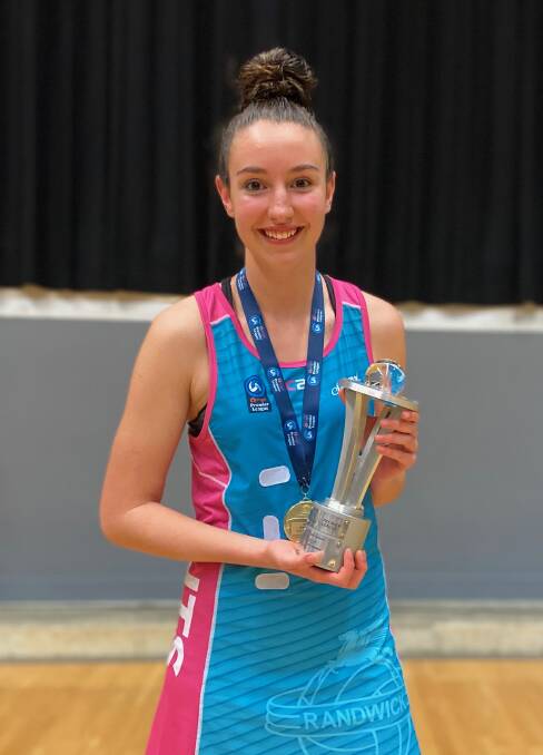 OUTSTANDING: Bathurst's Lilli Mooney holds the Netball NSW Under 23s Premier League trophy following the UTS Sparks' victory. Photo: CONTRIBUTED