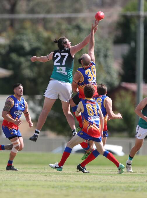 REACH: Harry Bowden contests for the ball during the Bathurst Bushrangers Rebels' round one meeting with the Dubbo Demons. Photo: PHIL BLATCH