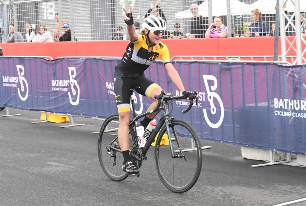 ENDURANCE: Jodie Martin celebrates as she crosses the finish line third overall in the Bathurst Cycling Classic. Martin takes on Grafton to Inverell this Saturday. Photo: CHRIS SEABROOK